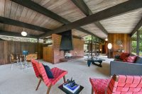 01 living room with mid-century moderm furniture and a brick fireplace wall