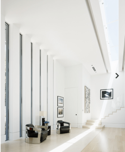 16ft windows and a skylight create drama and natural light