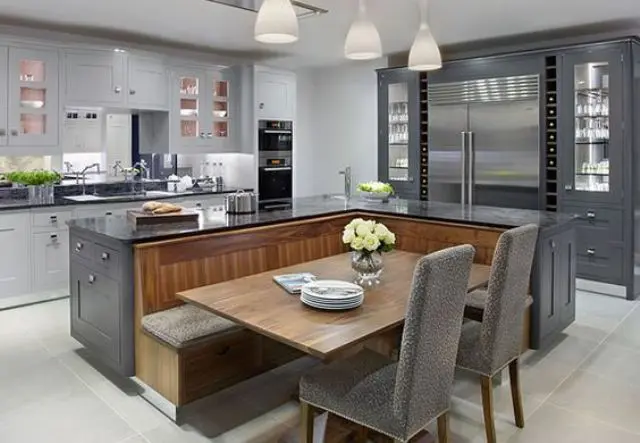 kitchen island that is combined with a fully functional seating area with a table