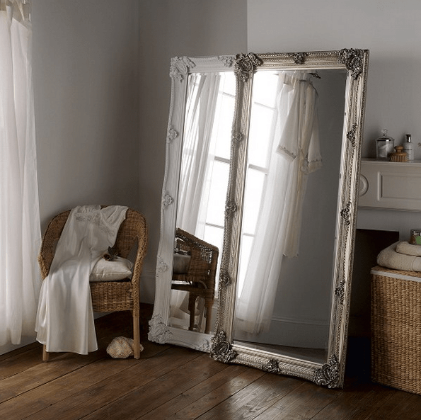 two tall mirrors create one more dimansion in your bedroom