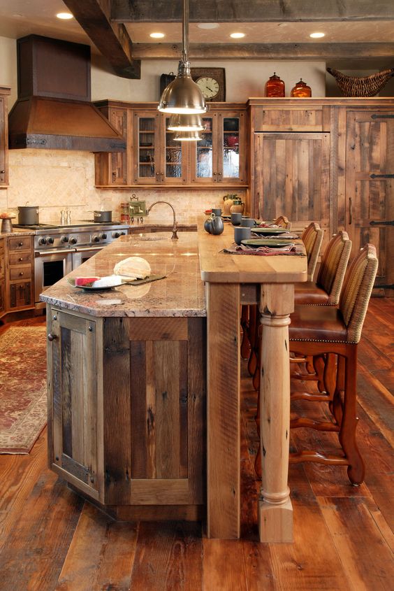 Rustic kitchen clad with warm colored wood