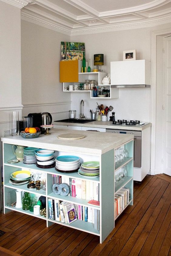 kitchen island with book and dishes storage