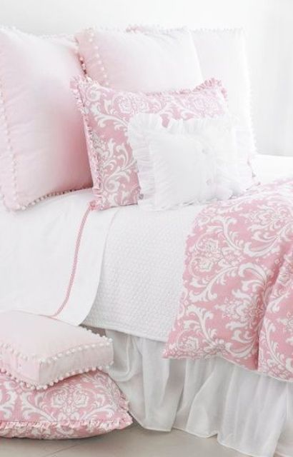 pink printed bedding with pompoms