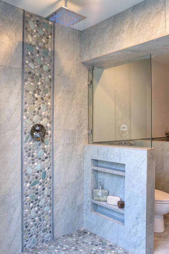 Stone inspired tiles with a pebble accent