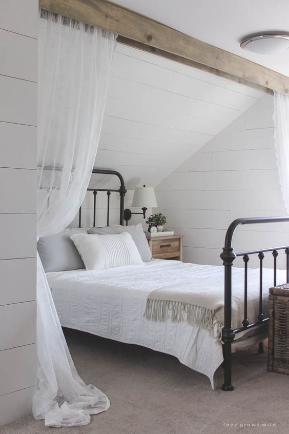 vintage-inspired bedroom with curtains for privacy