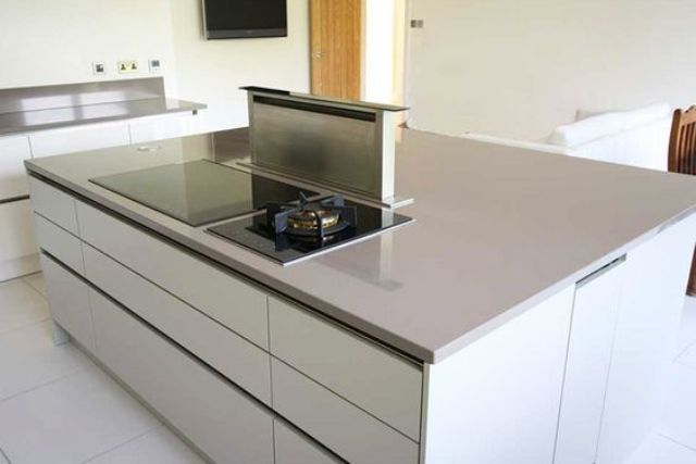 minimalist kitchen island with a built-in cook top
