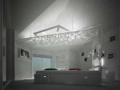 A Bedroom With A Complicated Canopy