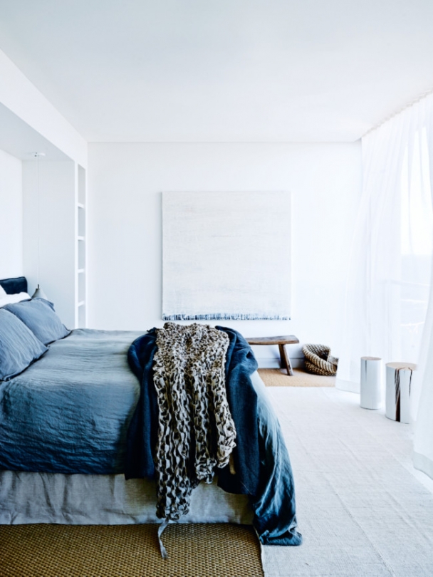 The master bedroom is soothing in washed out blue shades