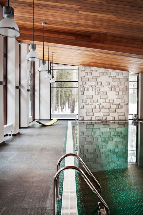 amazing modern indoor swimming pool with a tiled deck