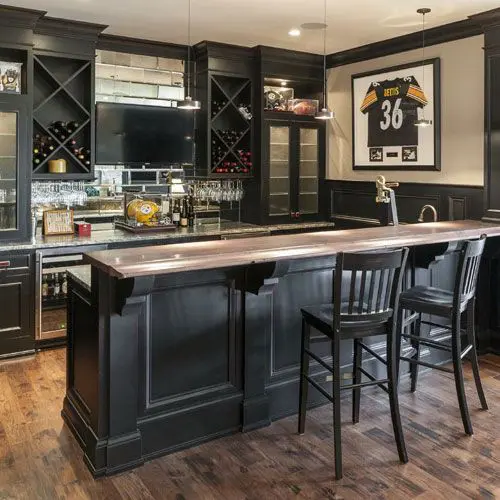 dark-colored basement bar with wine coolers