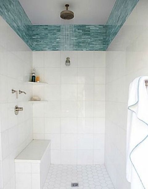 wide turquoise glass tile border in the shower