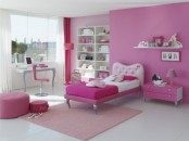 a hot pink and white girl’s bedroom with an accent wall, a light pink and hot pink bedding, pink poufs and pink curtains and a chair