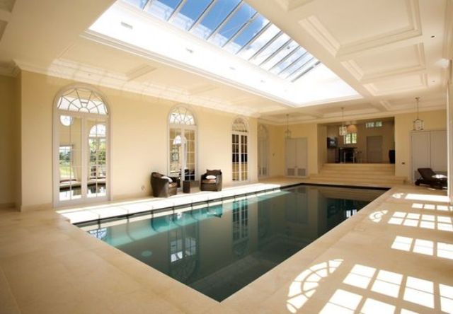 large indoor pool wwith a glass roof above