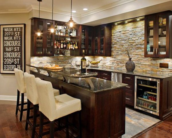 Chic dark colored basement bar with white chairs