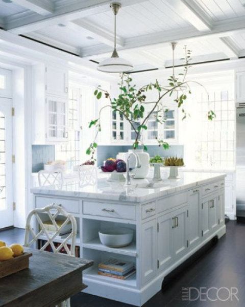 kitchen island with tableware and book storage