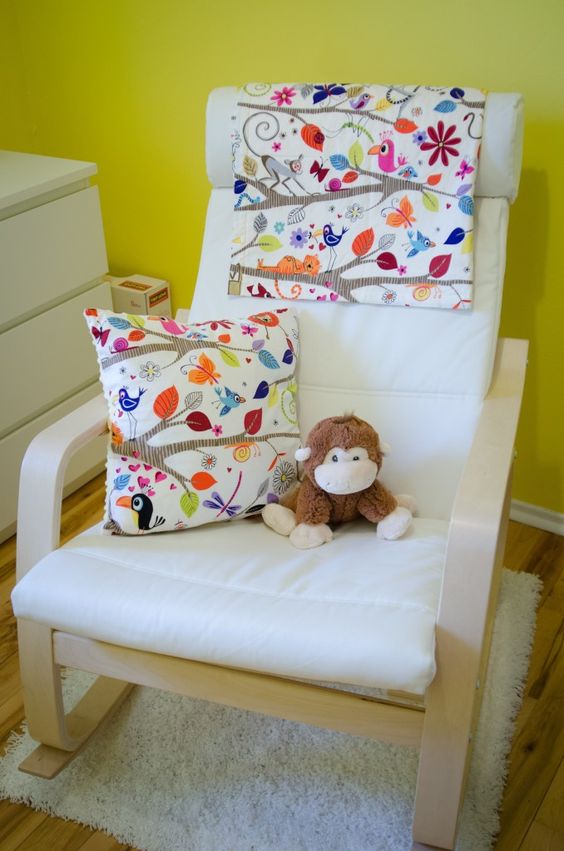 Poang chair with a floral pillow and