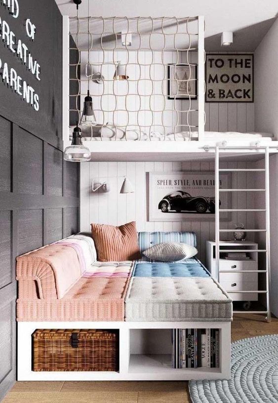 a catchy teen room with a loft bedroom, a catchy daybed with pillows, a small nightstnad and a black paneled wall