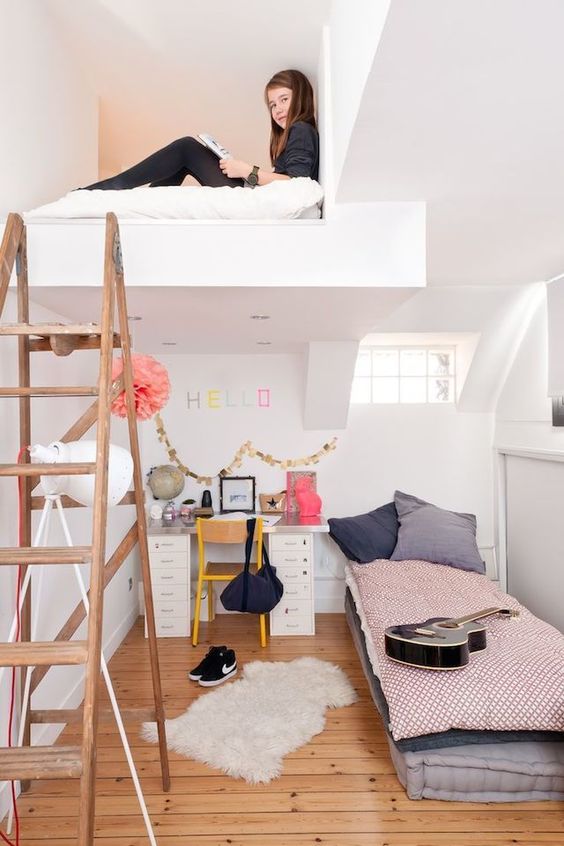 a cool teen room with a loft space for some privacy, a bed and a desk for studying and a ladder to climb up