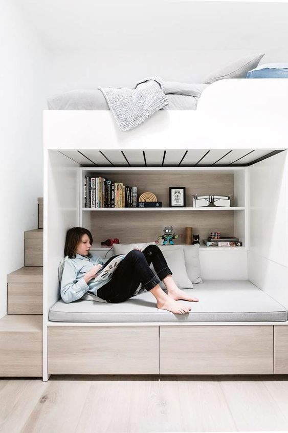 a minimalist teen room with a loft bedroom and a study and reading space down, with storage and built-in shelves is great