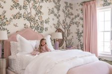 a cute kid’s room with a botanical wallpaper