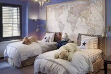 a nautical travel kids’ room with a map, blue walls and a cool star chandelier will easily fit both girls and boys