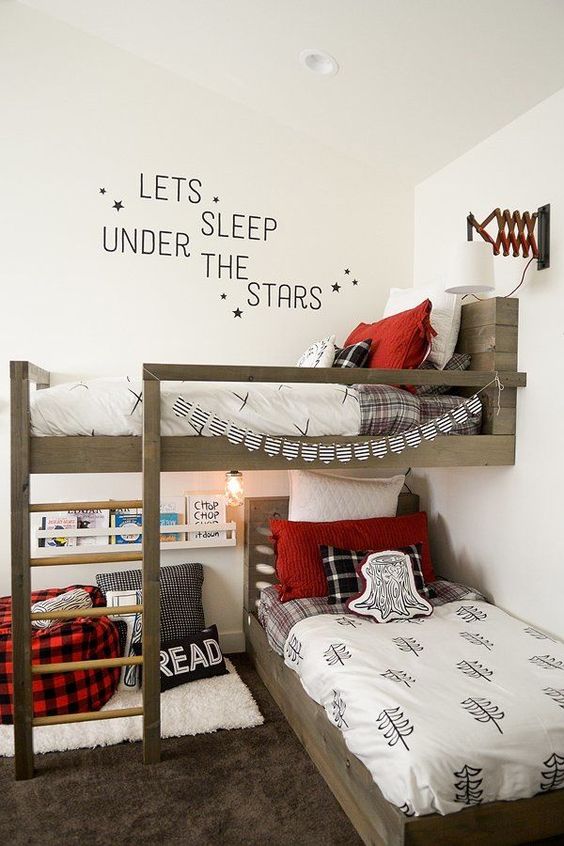 A shared lumbermen inspired kid's bedroom done in black, red and white with much light colored wood