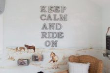 horse farm themed kids’ room with an artwork on the wall, toys and wicker furniture feels cozy and relaxed