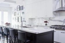 a stylish black and white kitchen with sleek cabinets, a black kitchen island with white marble countertops and a backsplash, black stools