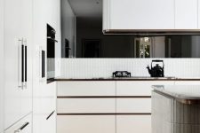 a white contemporary kitchen with sleek cabinets and a curved hood over the cooker is a stylish idea
