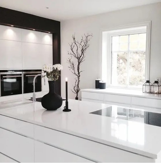 All white kitchen with a couple of black touches looks laconically Scandinavian and very ethereal