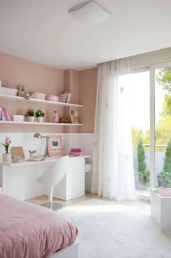 a romantic dusty, blush pink and white bedroom with pink bedding, heart printed curtains and simple white furniture