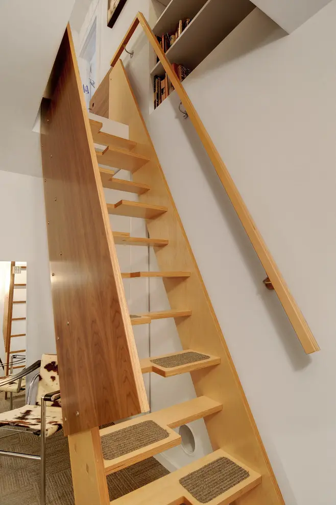 Small pieces of carpet would make such stairs more safe.