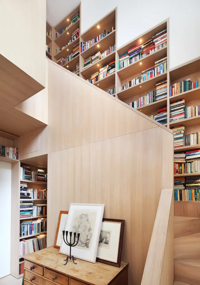 Staircase is a great place to organize additional book storage.