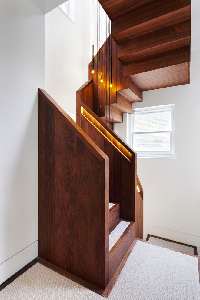 Even a compact staircase could be quite stylish and beautiful if it's made of wood. (Fraher Architects)