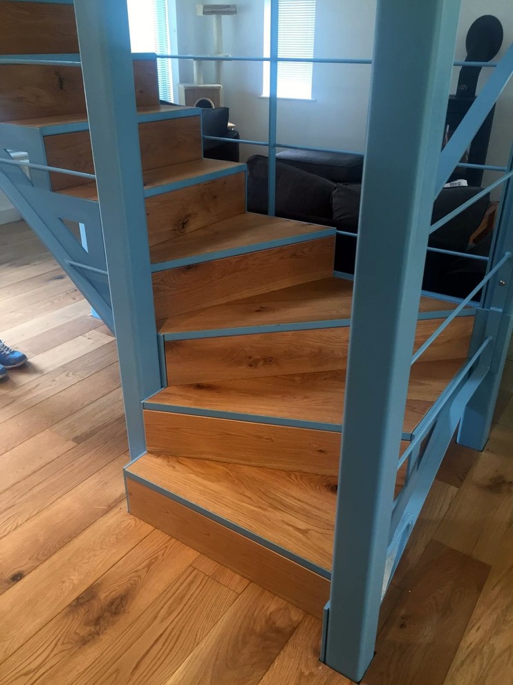 This compact staircase is made of steel and wood. Light blue looks good in a mix with natural wood. (Elysion Ltd)