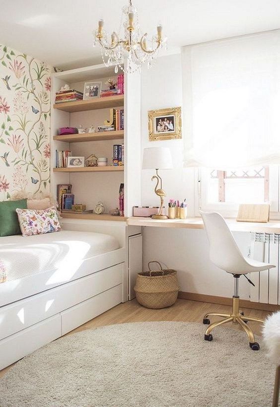 a fresh contemporary bedroom with a storage unit, a bed with stroage drawers and a floating windowsill desk