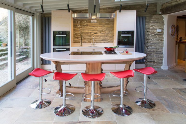 round kitchen island is much more interesting choice than a standard rectangular one