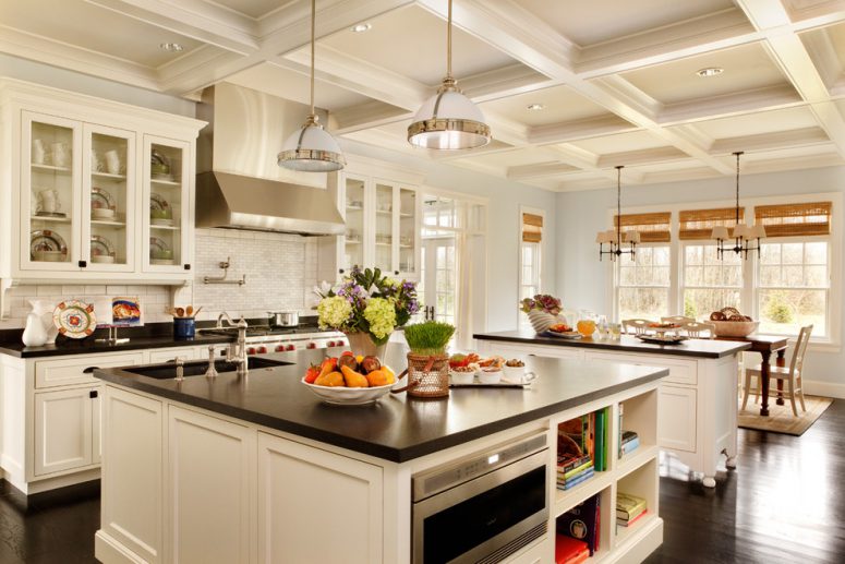 two traditional kitchen islands provide lots of storage and space for a built-in oven