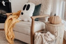 a ghost garland and a ghost pillow for cute and fun Halloween decor are a nice decor you can DIY