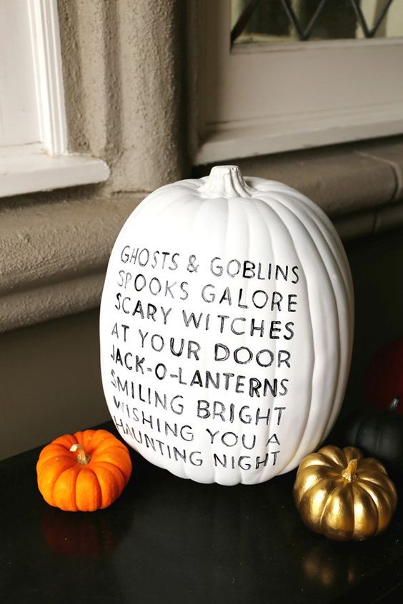 A white pumpkin decorated with a sharpie   with a cute rhyme inspried by Halloween is a simple and lovely idea