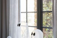 an arrangement of cheesecloth ghosts is a lovely idea for Halloween, great for kids’ parties