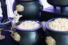 cauldrons used for displaying sweets at a Halloween party, they can be rocked both at a kid and adult celebration