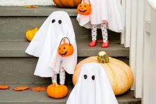 fun cheesecloth ghosts with candy baskets are lovely decor that will offer sweets for kids