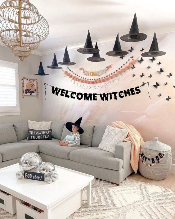 lovely Halloween decor with witches' hats, bats, butterflies and disco balls is amazing for kids' and adult parties