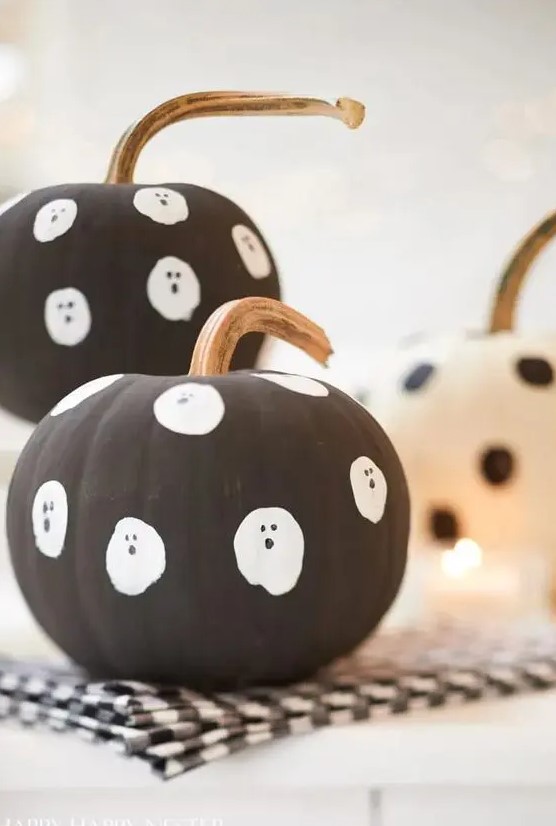 make some easy matte black pumpkins with ghosts for your kids' Halloween party