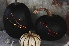 matte black constellation pumpkins are adorable for Halloween and look veyr stylish and bold, they arne’t scary at all and you may use them just in the fall, too