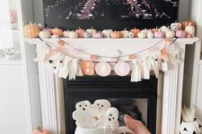 pastel pumpkins, a letter banner and some ghosts will easily fit both a kids’ and an adults’ party