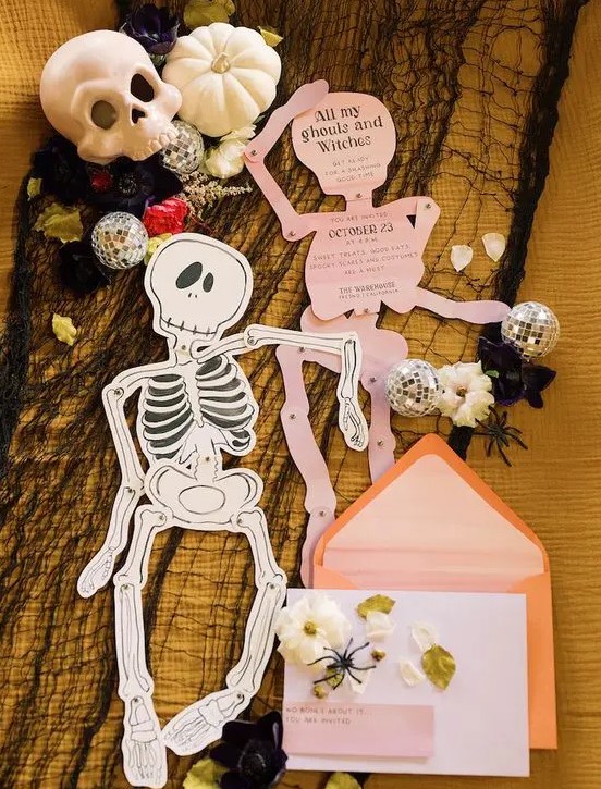 Skeleton shaped invitations in pink andorange envelopes will be afun and cool idea for both a kids' and adults' party