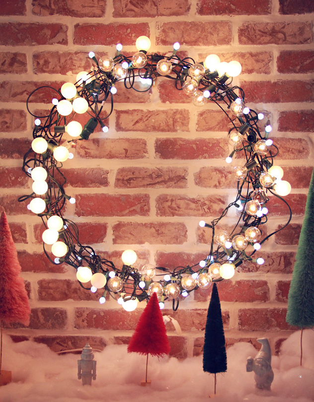 Light string Christmas wreath is a great idea to make your front door even more welcoming.