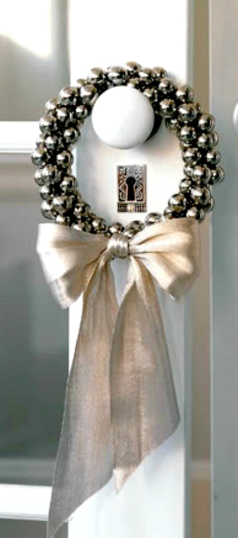 Small jingle bell wreath would look pretty on any doorknob. This's a cool idea to decorate interior doors for holidays.